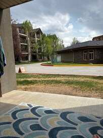 Sitting on the patio directly across from pool house and gym.