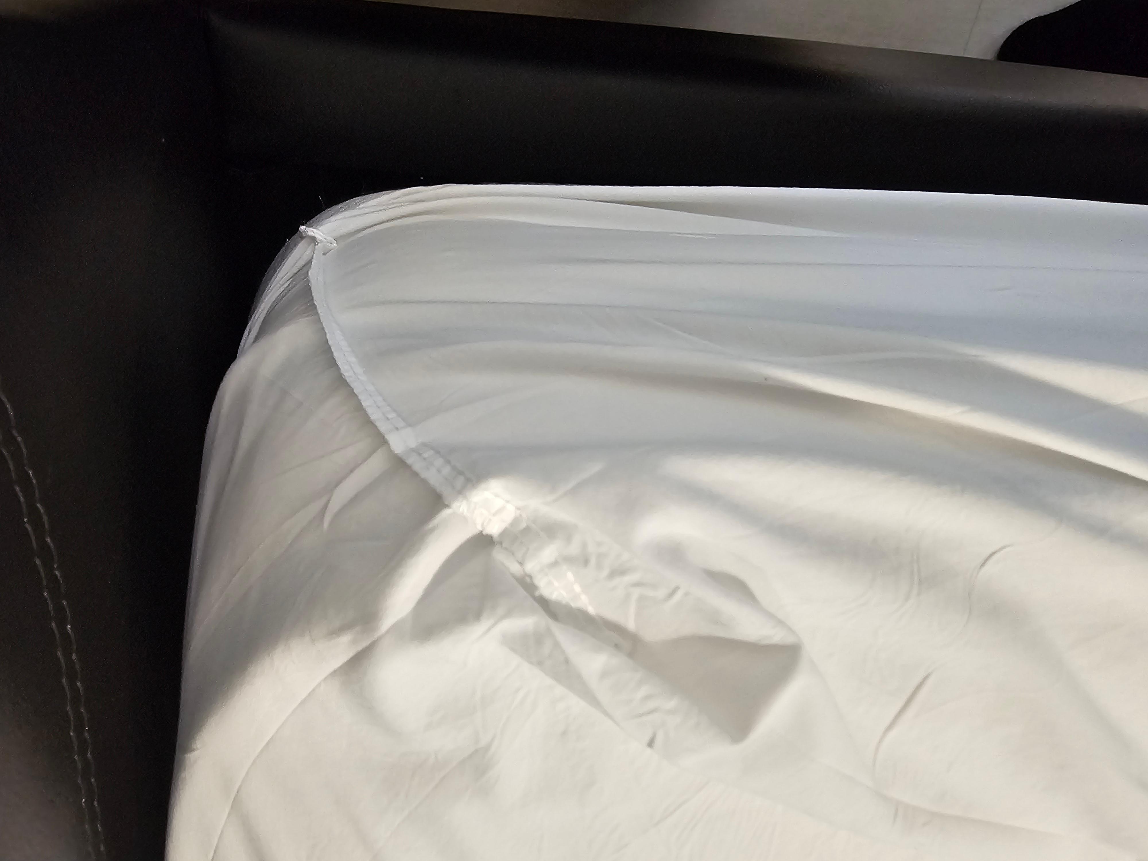 The bed sheets was put on inside out. 