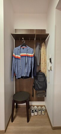 Cozy nook at entrance of apt for easy storage