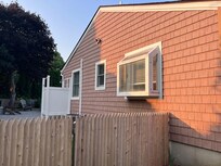 View from the front of the house and its left yard and gate entrance.
