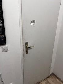 Hole in back of room door