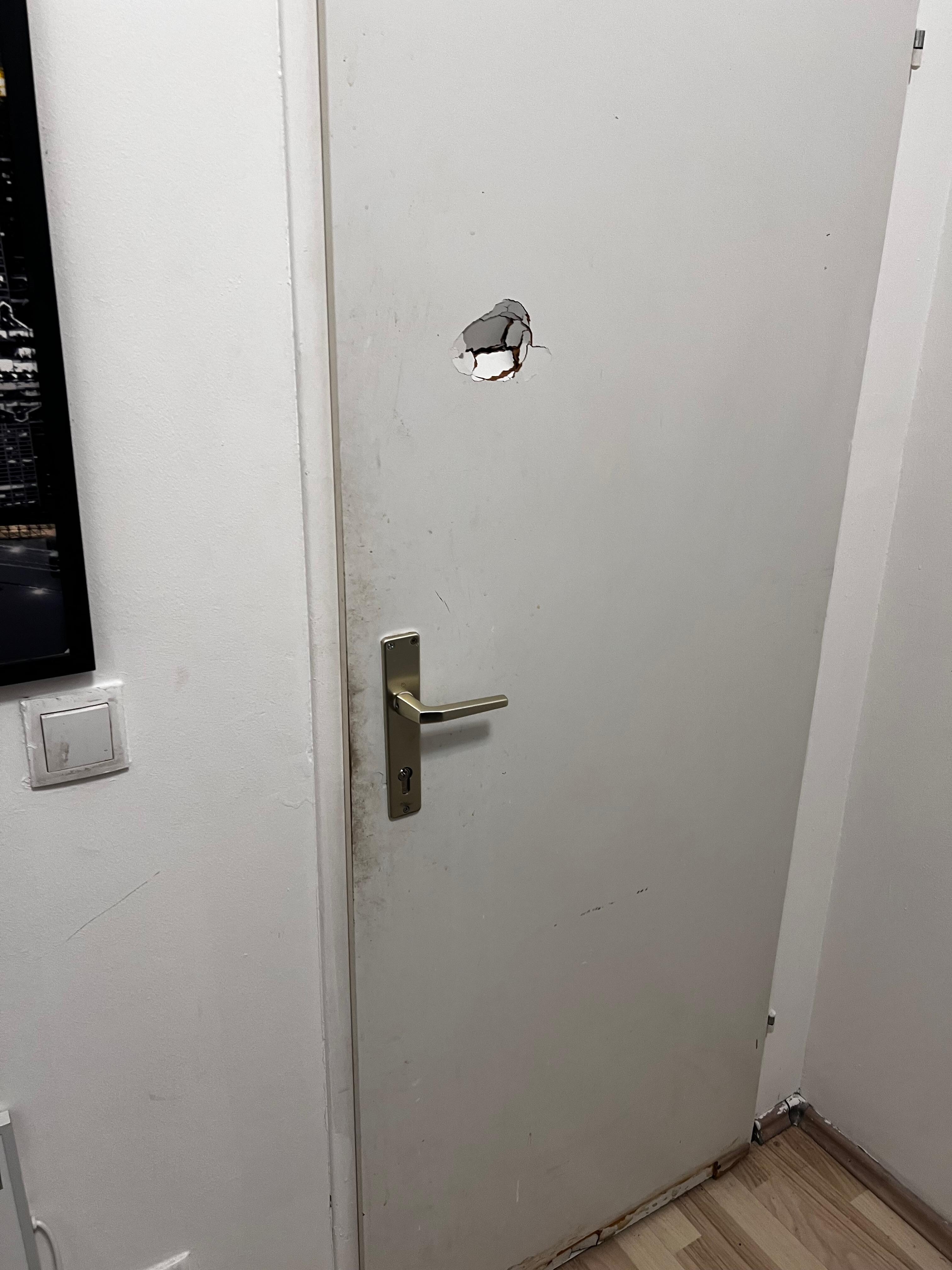 Hole in back of room door