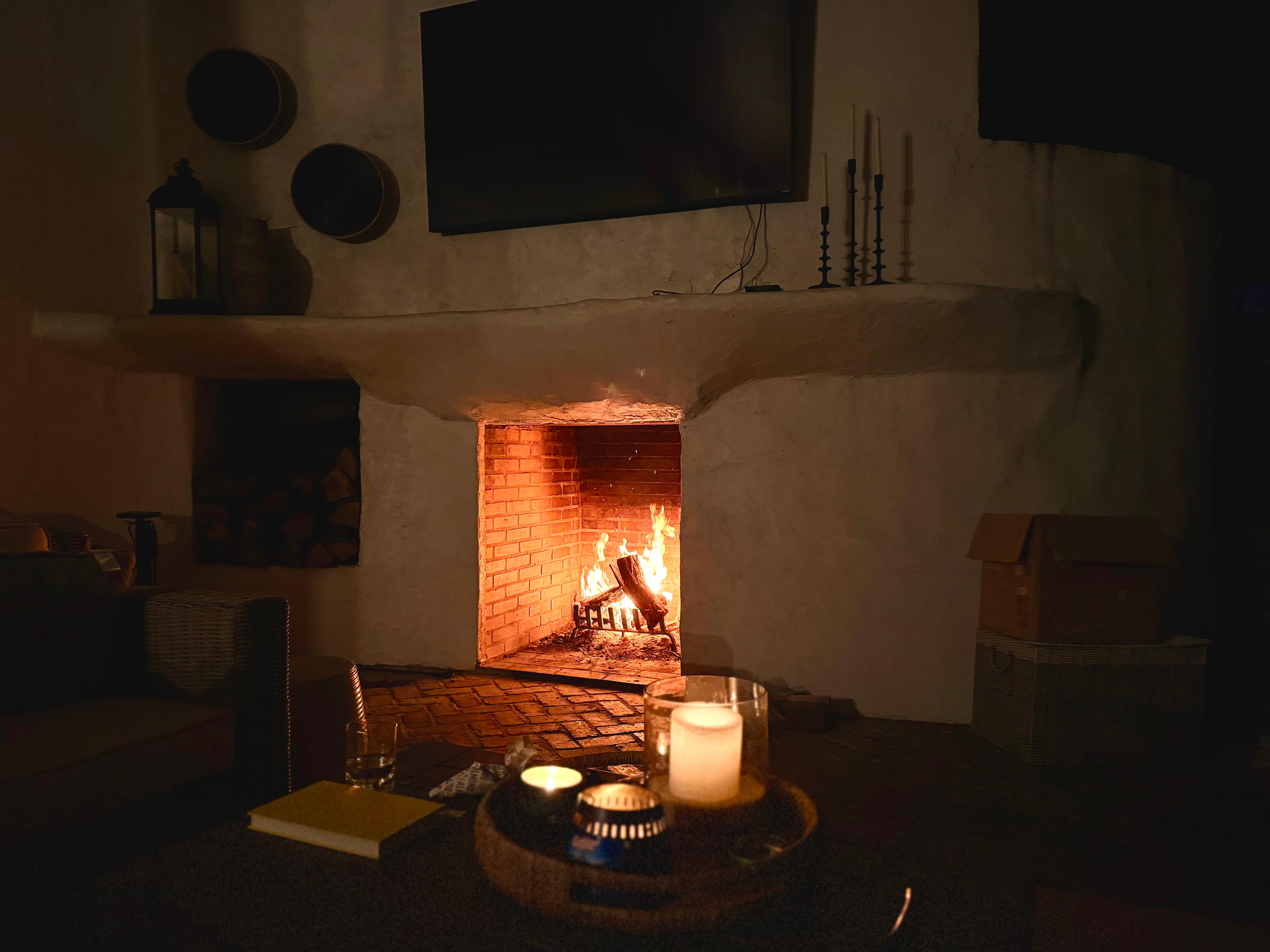 Outdoor fireplace near the lake