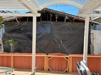 This house right in front of the deck burned down five years ago. It was not shown in the ad.