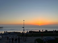 Sunset from he balcony of a room with partial beach view.