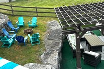 Fire pit and pergola near pool