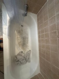 The tub and we decided to use their towel to stand on because I didn’t have shower shoes