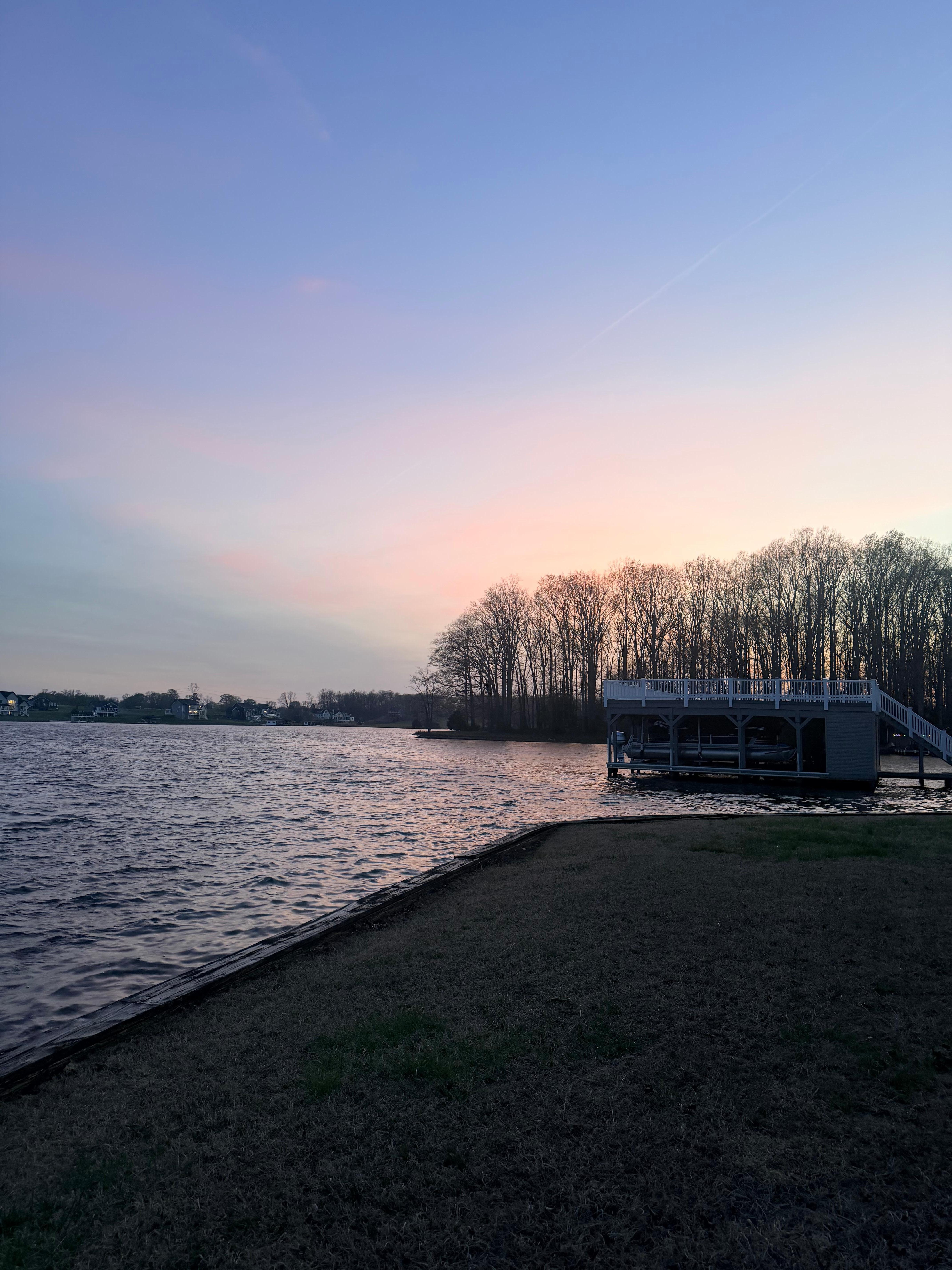 Sunset from the point at the tip of the property. We loved walking out here and fishing into the open lake. 