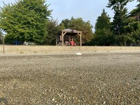 Looking towards the property from the water. Romeo is by the retaining wall.