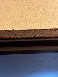 Close up of rust on bathroom door