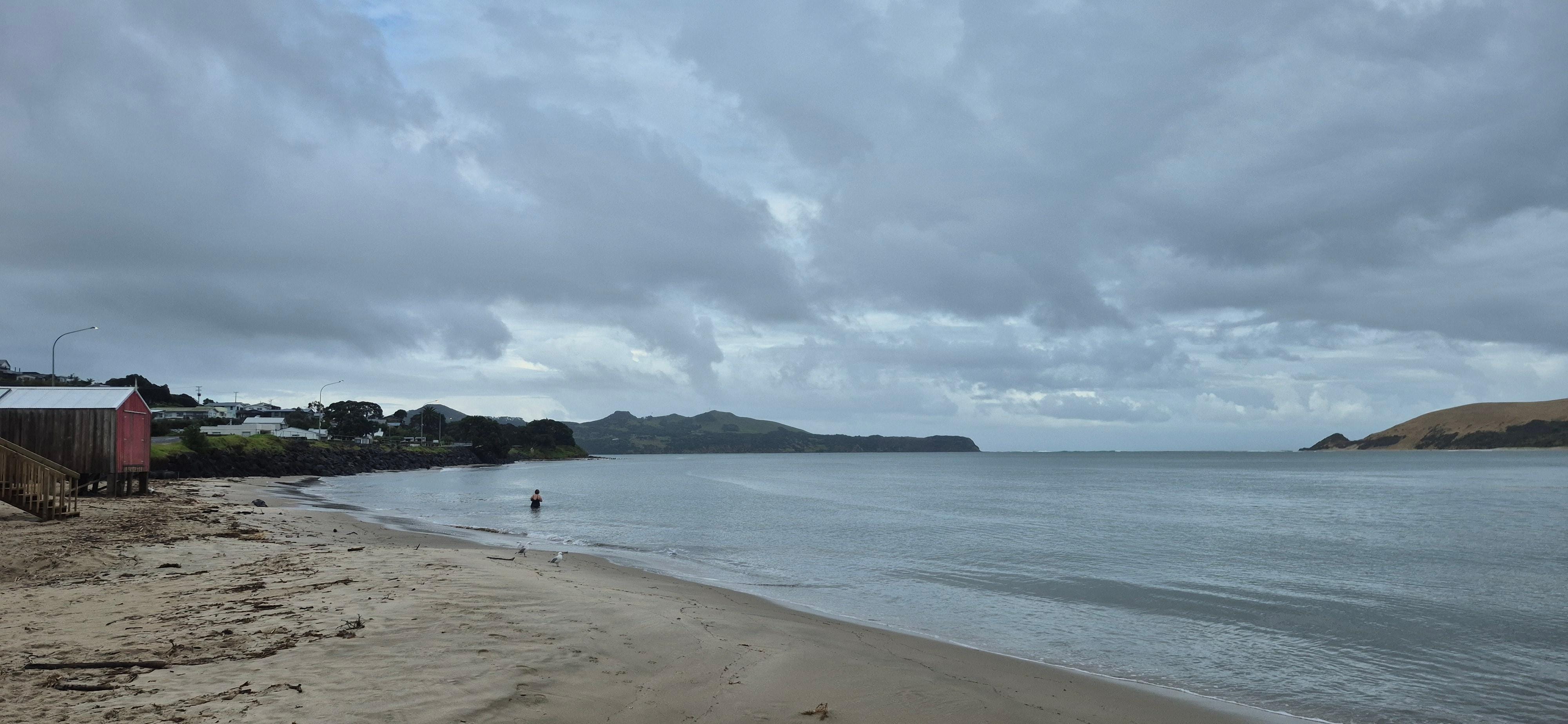 Other side if yhe beach complete with swimmer