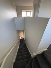 For someone curious about what is split bedroom. No ground floor, level 1 dining living room, level 2&3 bedrooms