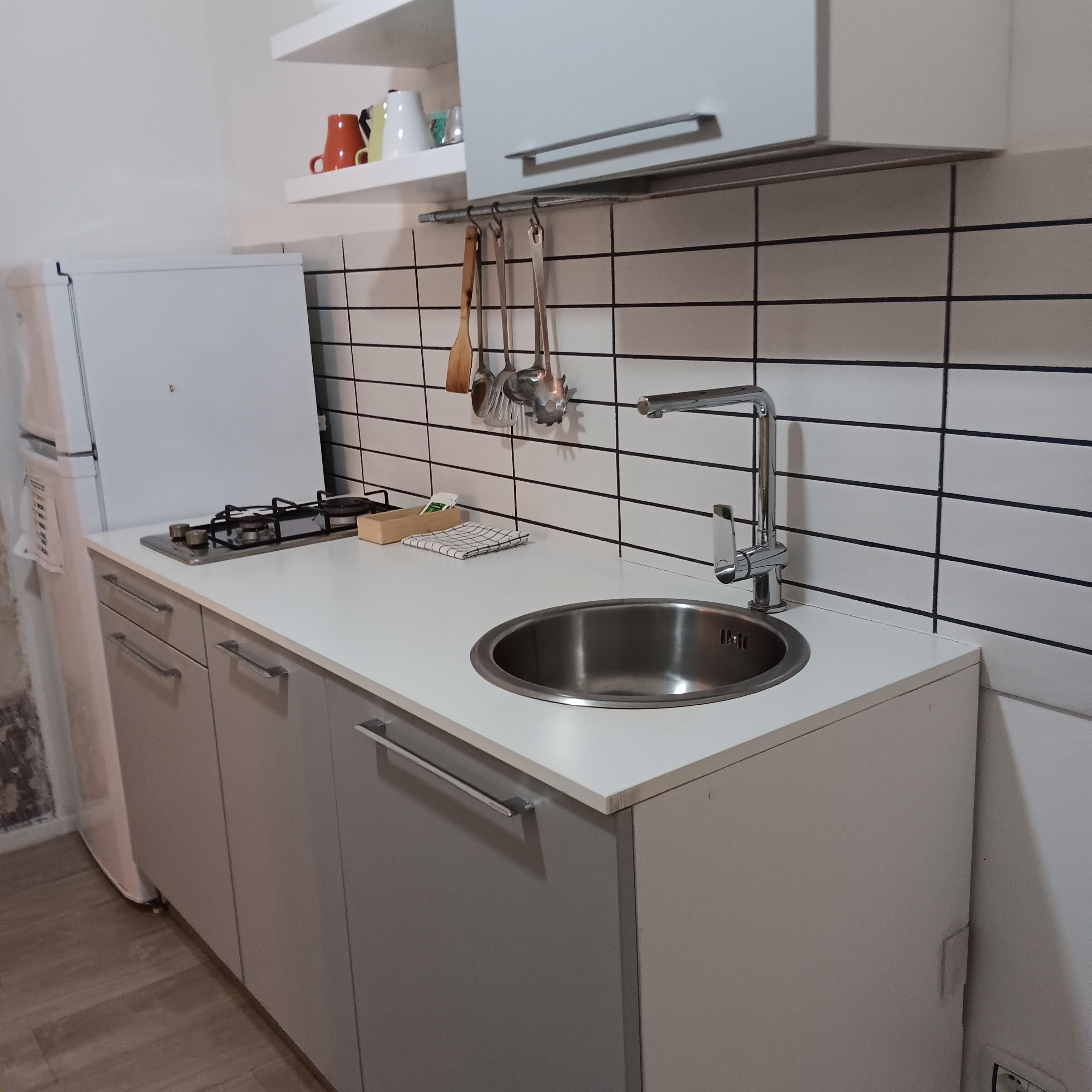 Roomy kitchen with table.
