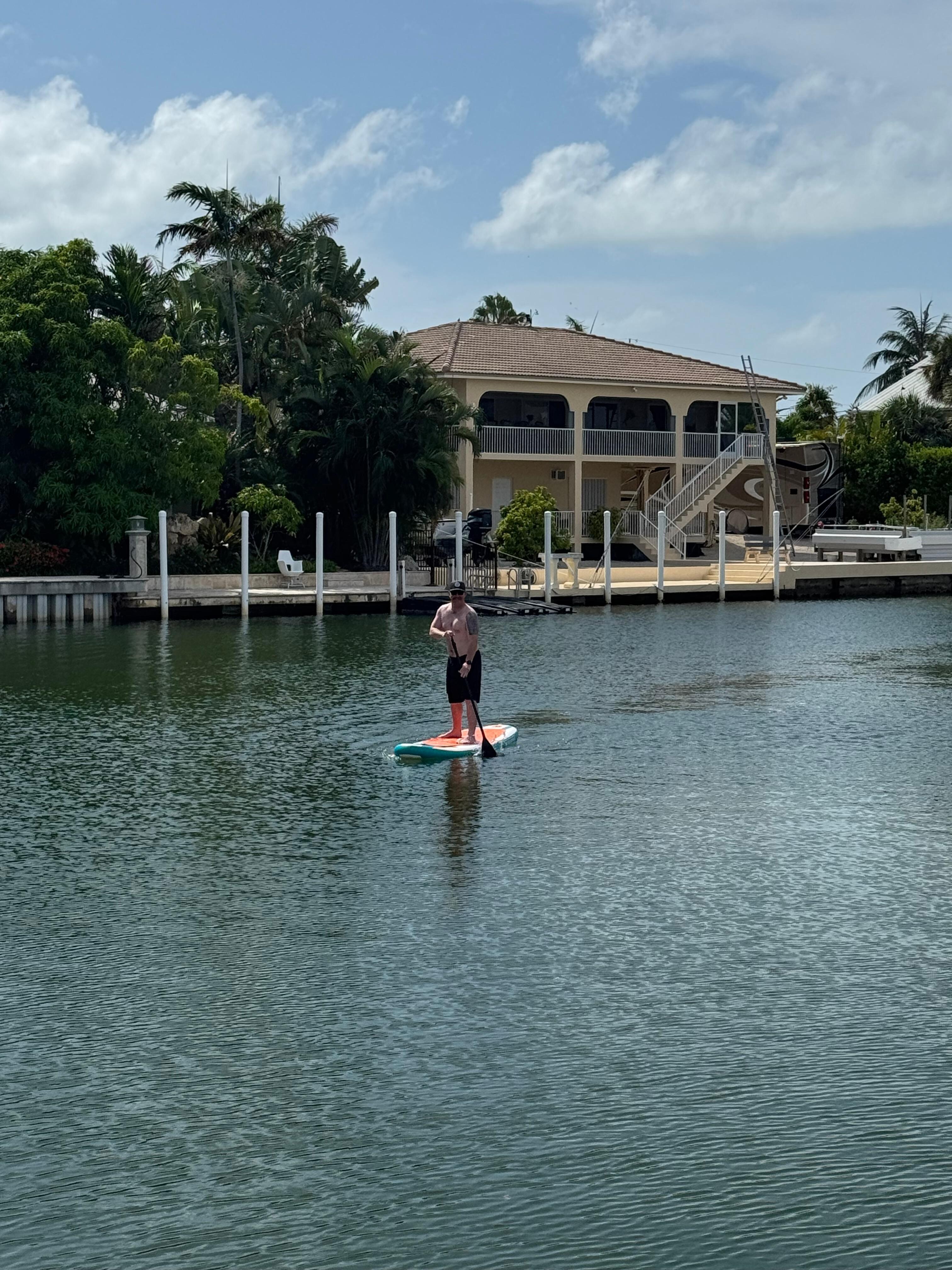 Trying out our paddle board. 