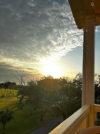 The sun beginning to break from the upper porch.