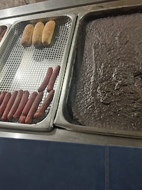 This is the tray with hot dogs beans and bread sitting all day. No temperature check on food. This was so scary and disappointing to see.