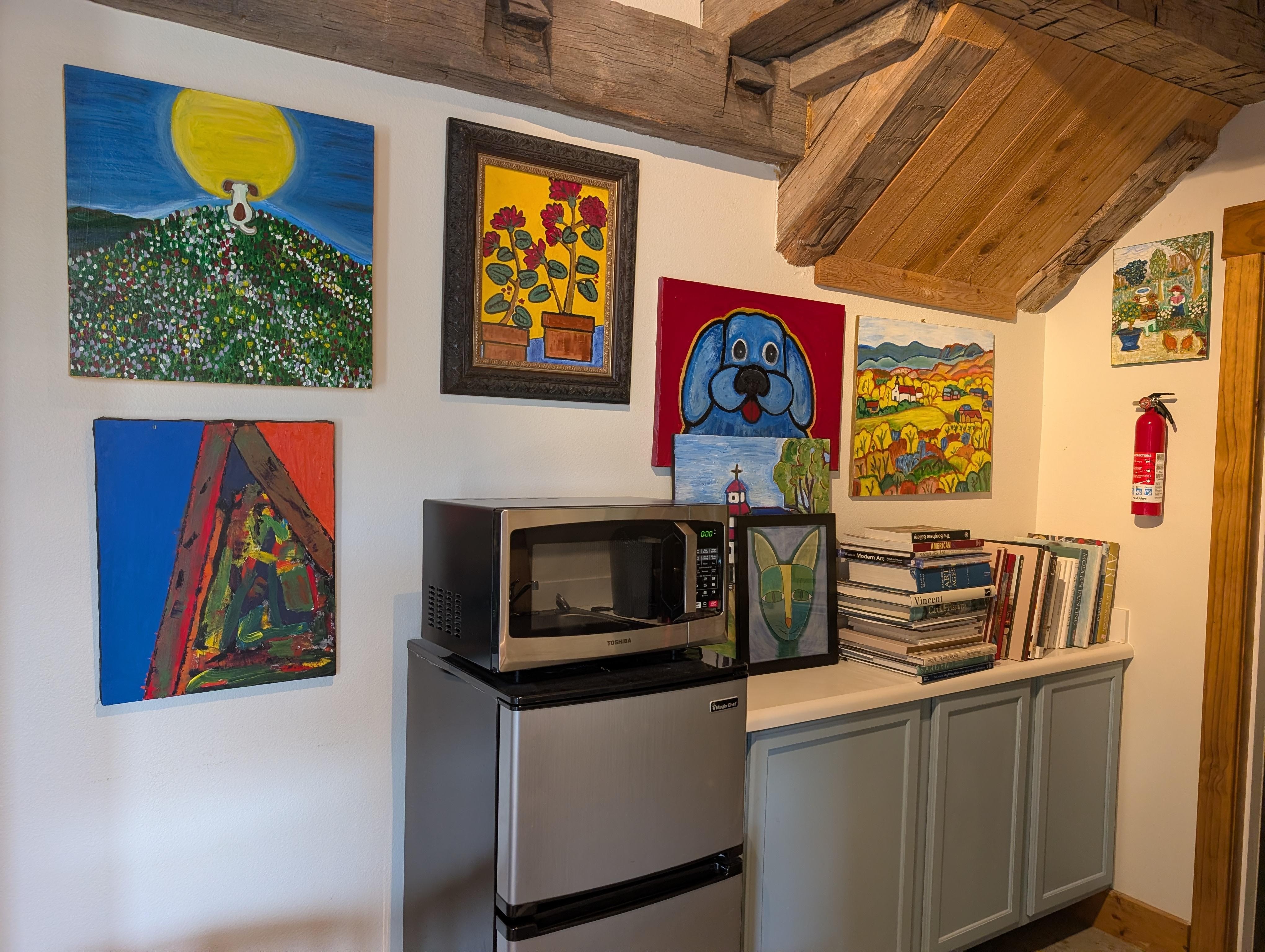 Cheerful art in the kitchenette area.