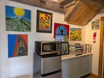 Cheerful art in the kitchenette area.