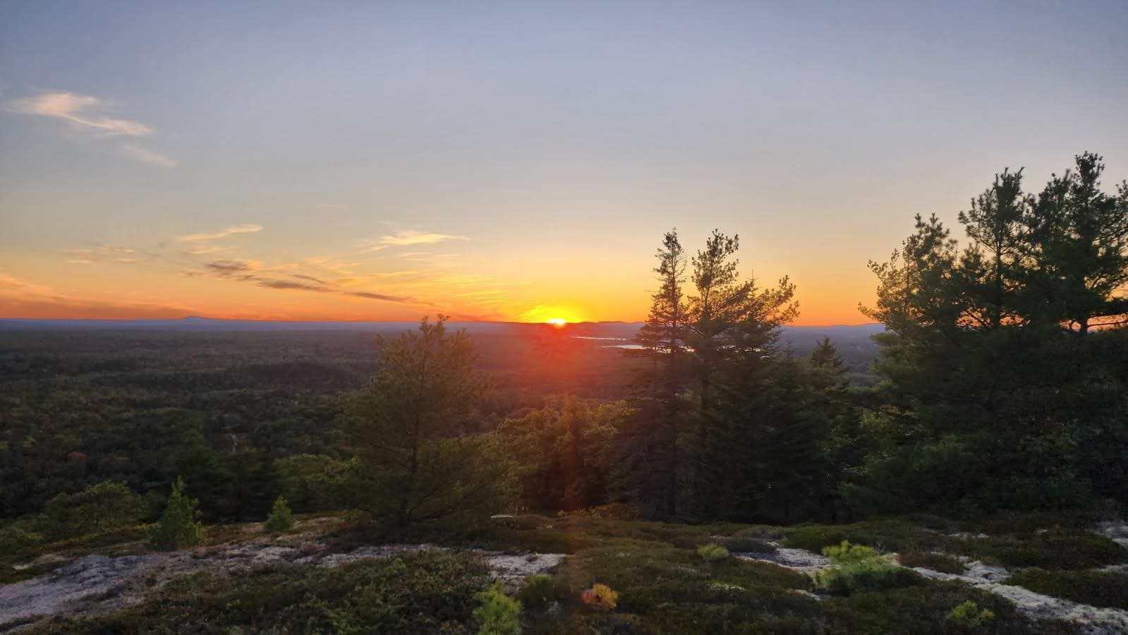 Sunset looking at Taylor camp from the mountain across Tunk Lake