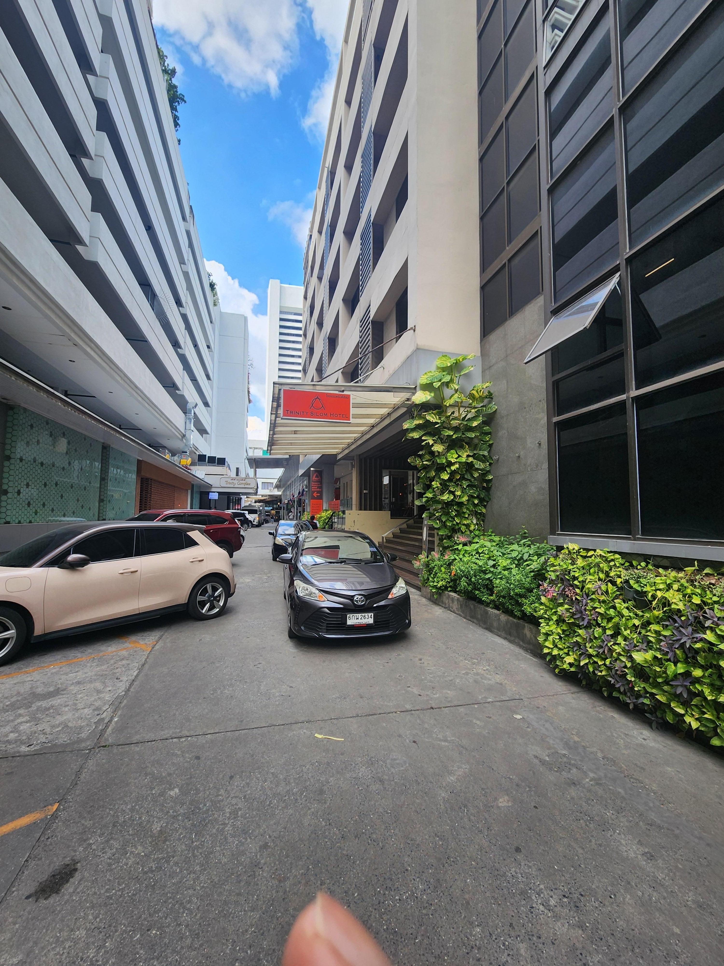 Location is off the street. Sometimes hard for Grab driver's to find lobby entrance. It is next to Trinity Complex. 