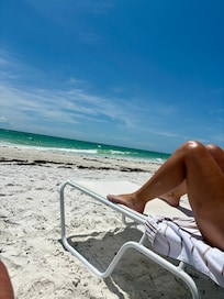 Sunloungers and umbrellas on their beach