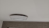 Extractor fan lose at the wall, not fitted flush.