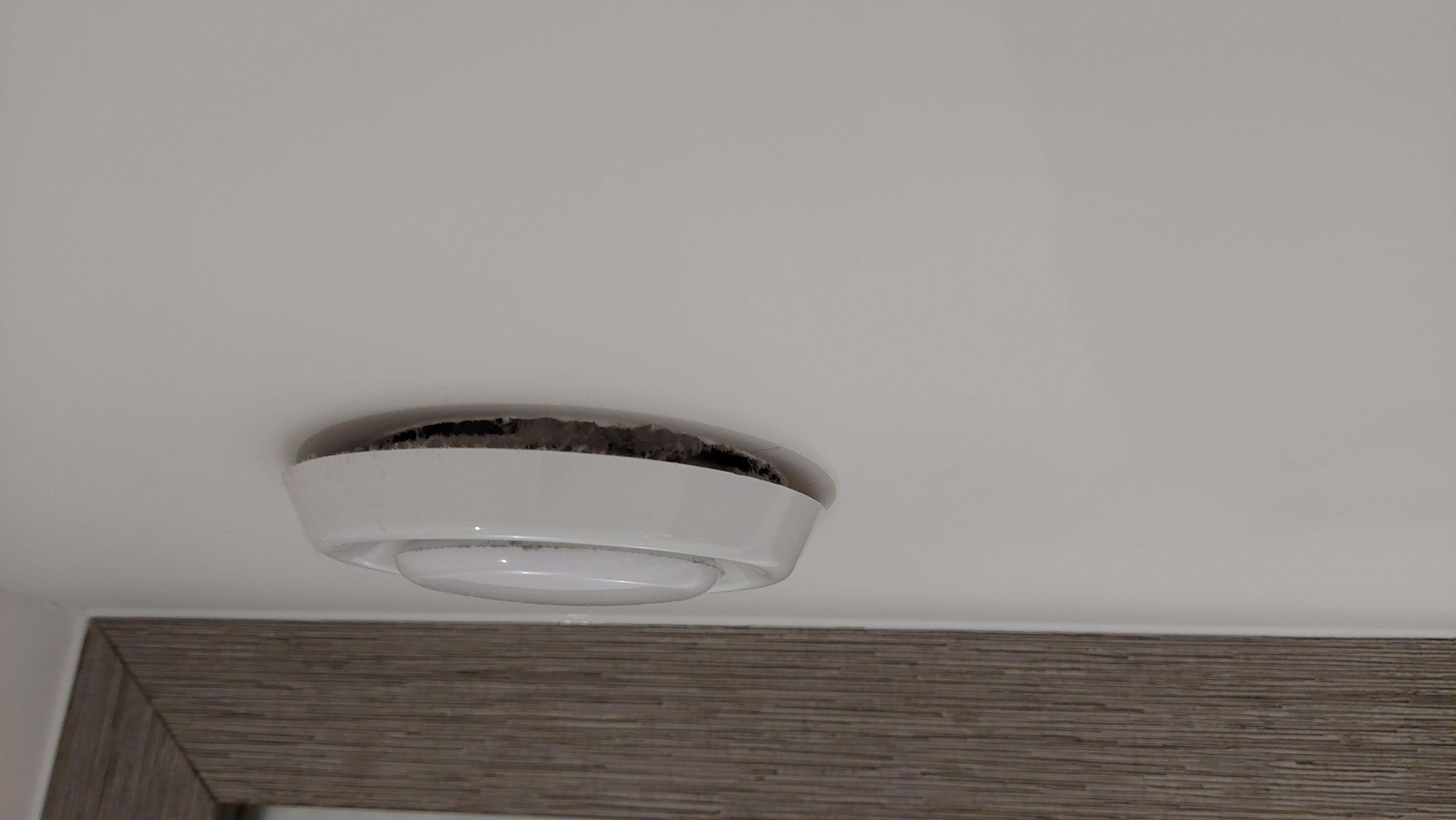 Extractor fan lose at the wall, not fitted flush.