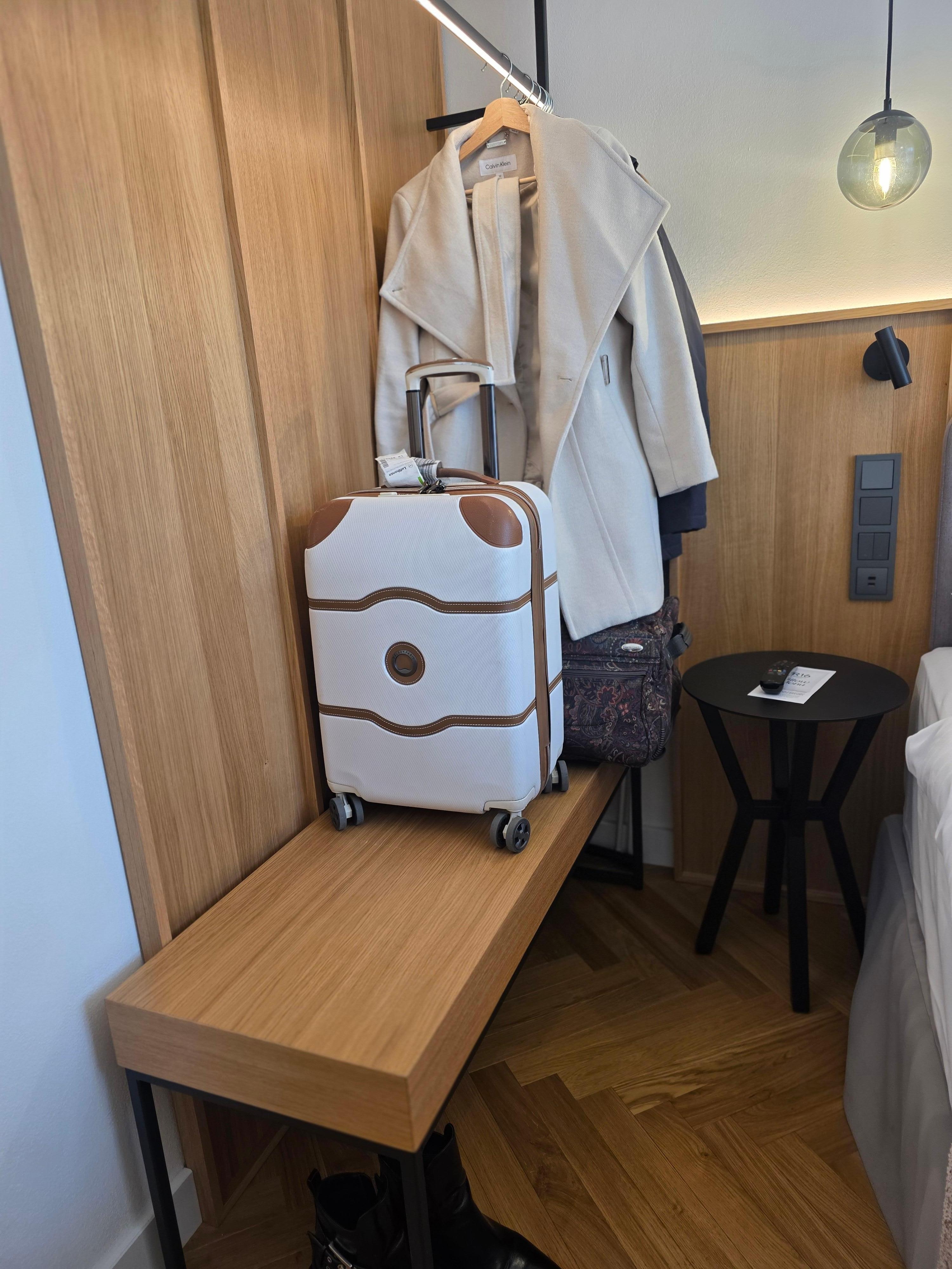 Rack and bench for clothes, with ironing board and iron available 