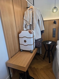 Rack and bench for clothes, with ironing board and iron available