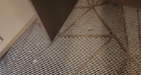 A shrimp tail and other crumbs under the study desk.