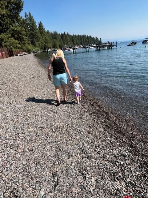 Nana and Ellen walking on the beach.