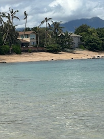 In the water looking at the house
