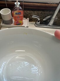 Bowl from cabinet with food on it.