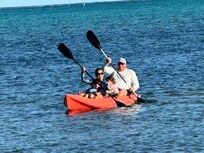Kayaking in front of house