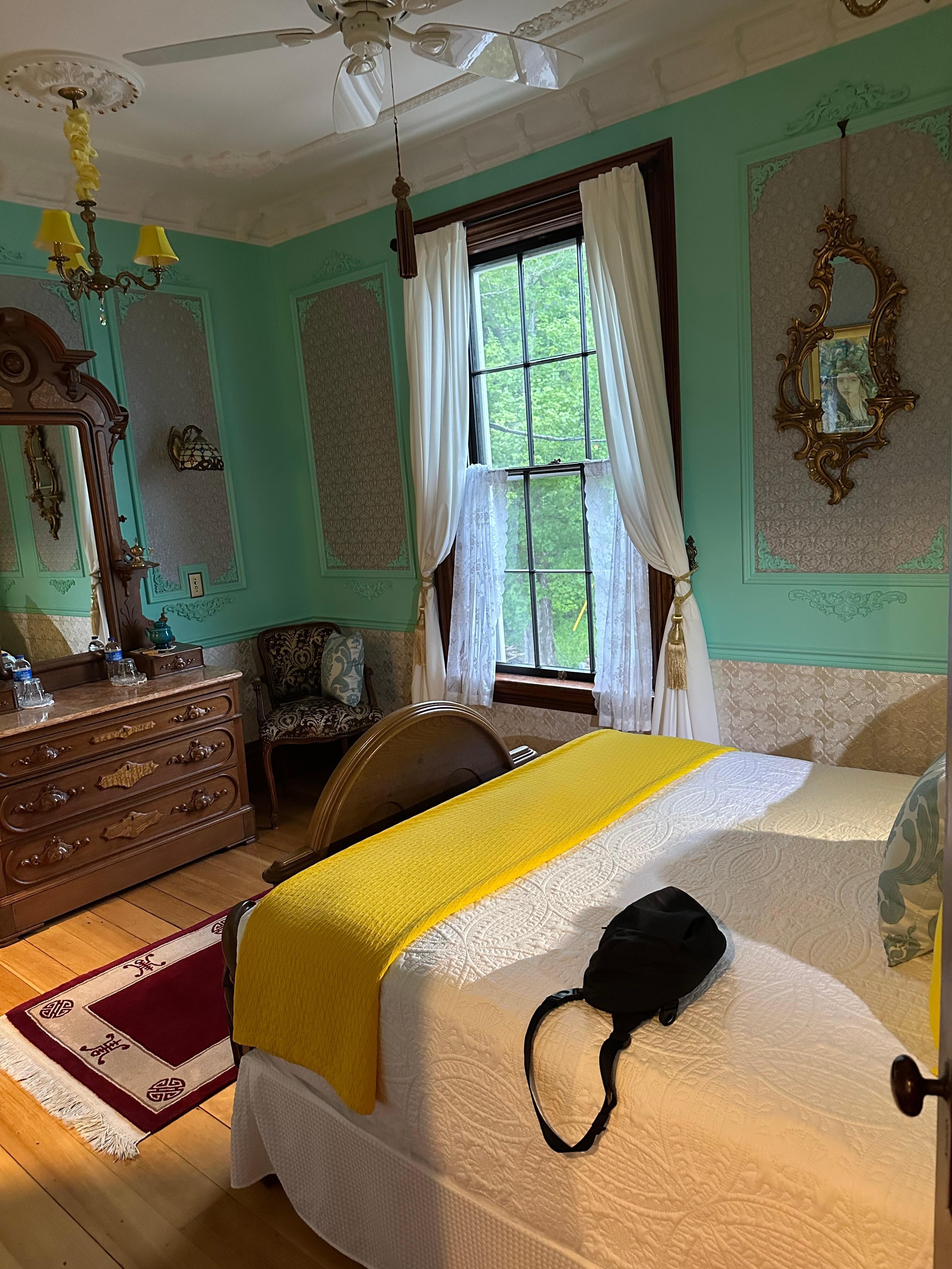 The second room with extra bed and kitchenette.