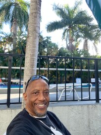 On-site pool with lounge chairs and tables for dining.