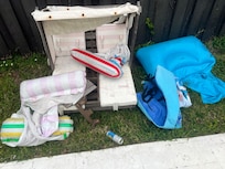 This was by the pool-broken toys and a beer can