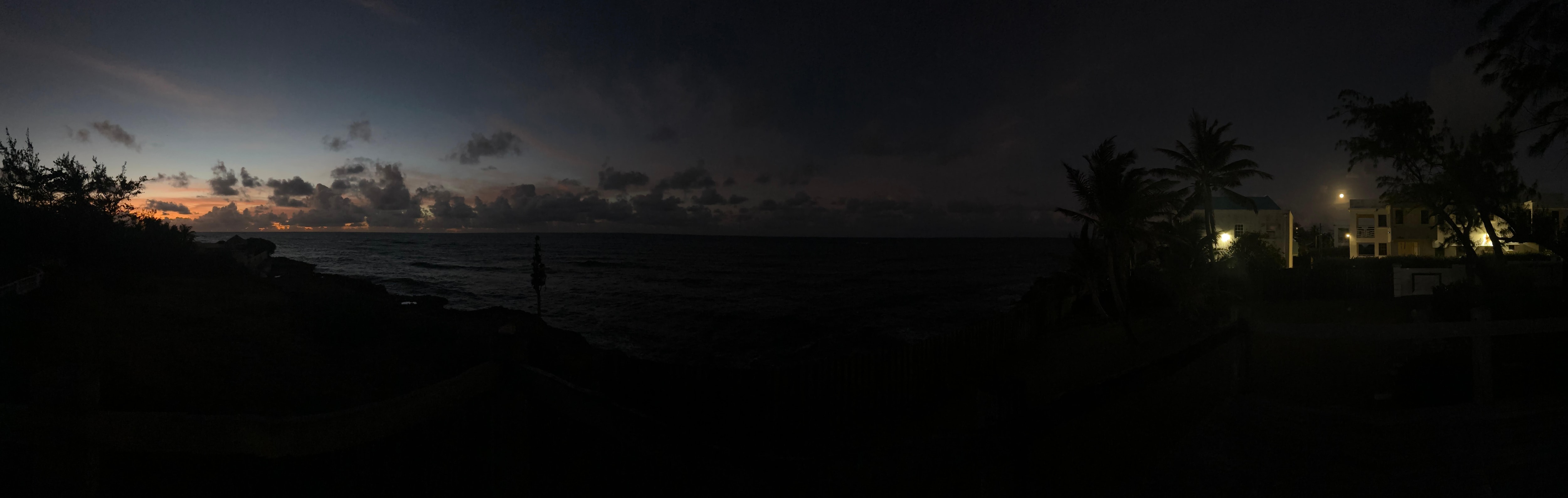 Sunrise in the east as seen from the backyard platform with the moon still visible to the west. 