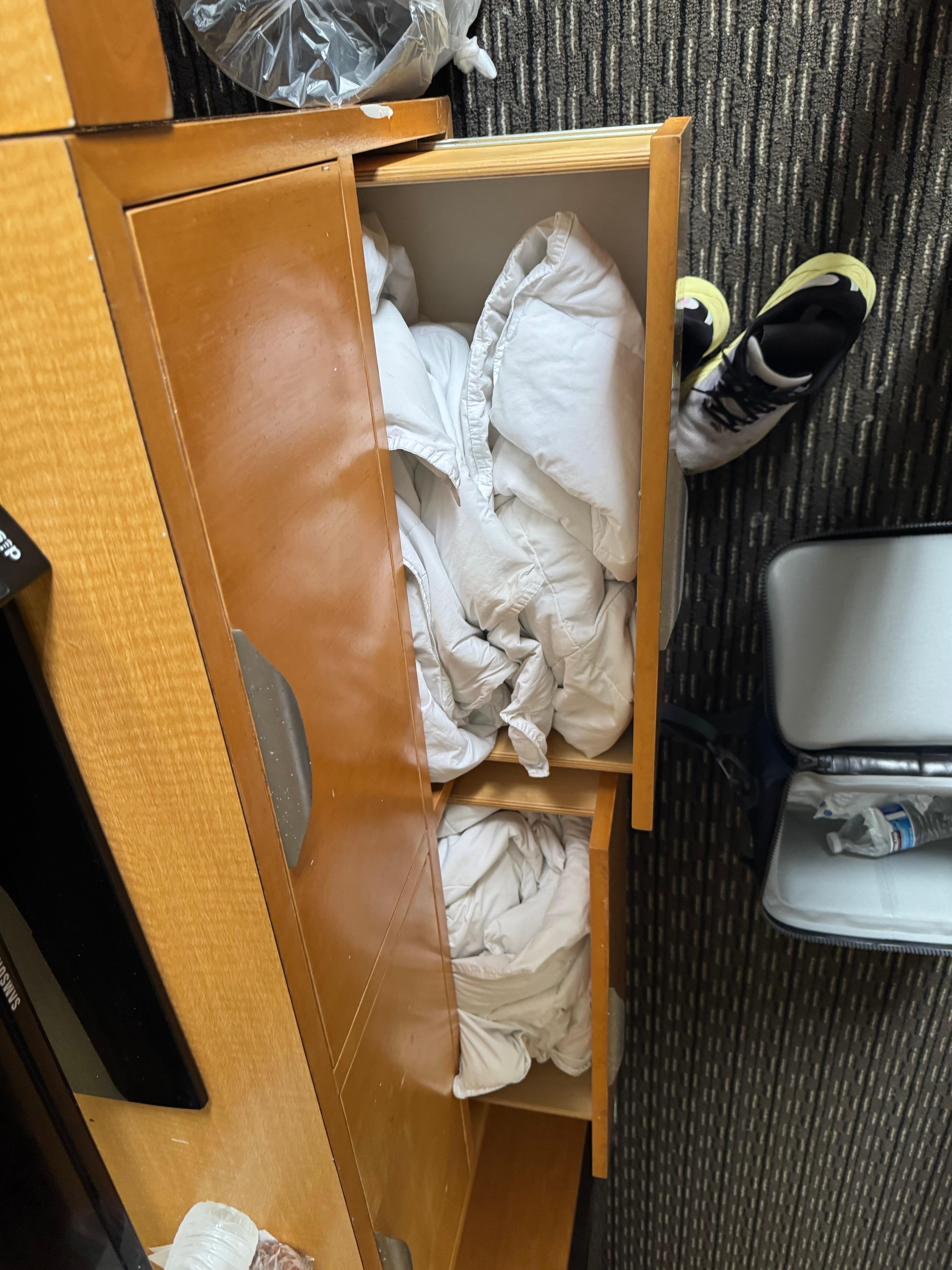 Drawer open blankets shoved not folded. Also both were horribly stained