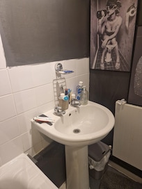 Bathroom with host's personal items.