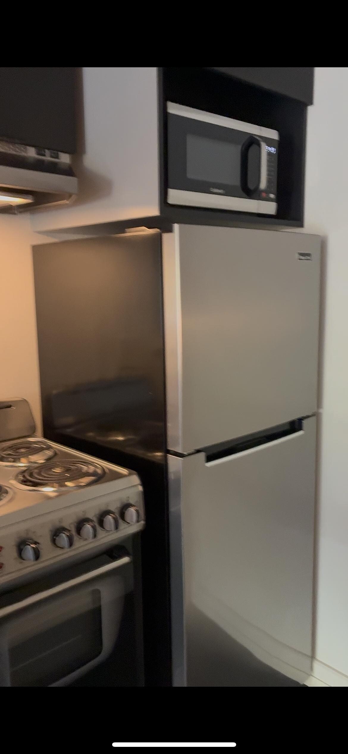 Fridge, freezer, microwave, stove, oven, and there was also a sink and kettle