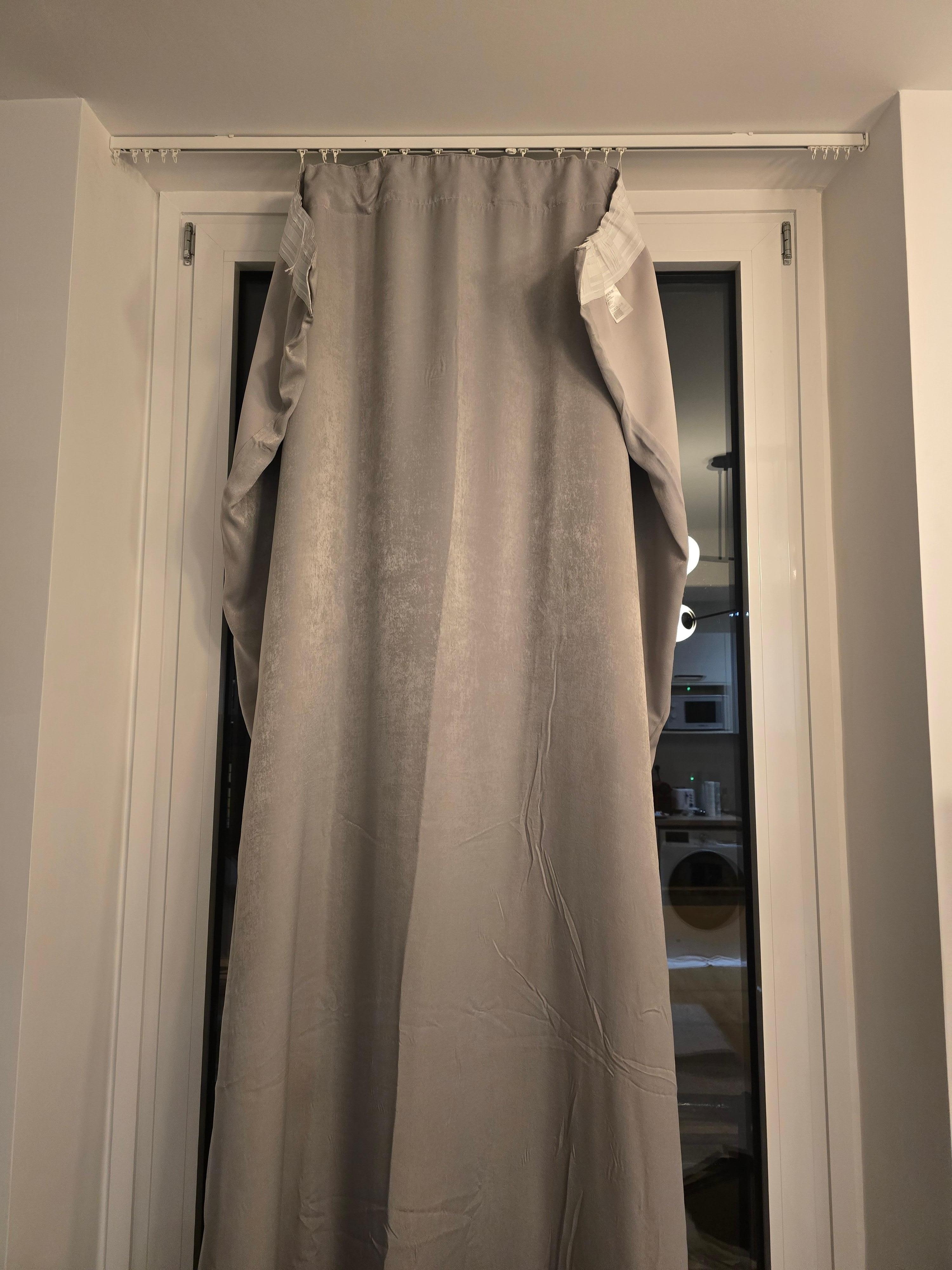 Cheap curtains let noise and light in. Hanging by a string, no rings. They came off as soon as you tried to open/close them.