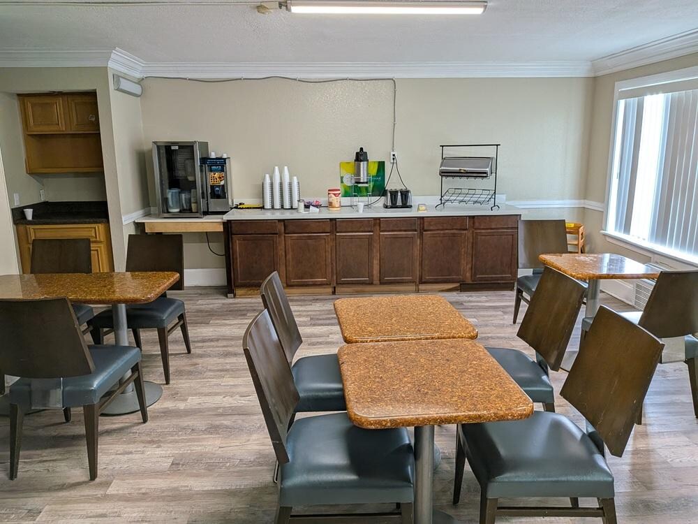 Note the contents of the refrigerator. Almost out of milk and juice.  I jug of tepic coffee.