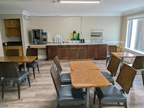 Note the contents of the refrigerator. Almost out of milk and juice.  I jug of tepic coffee.