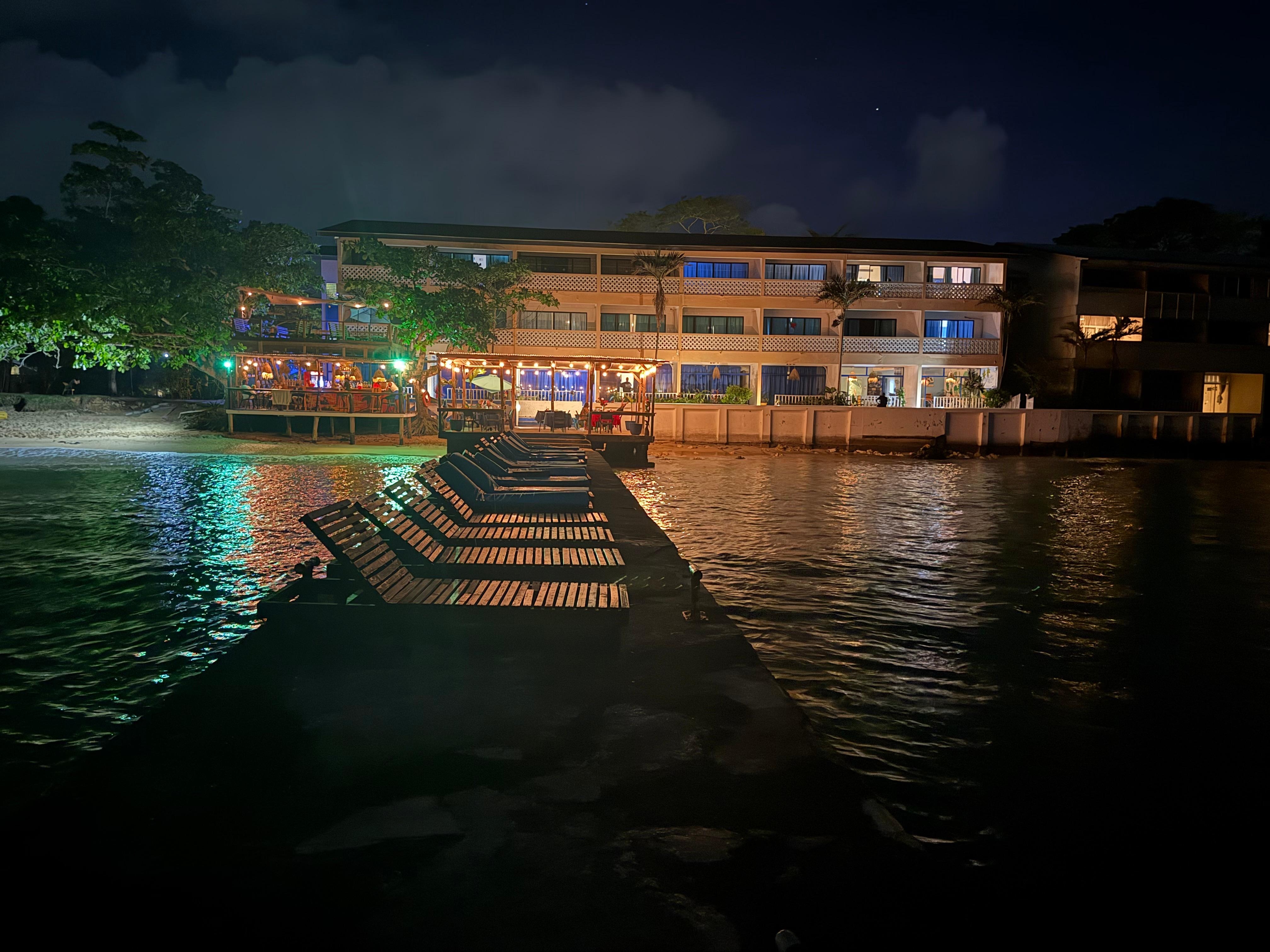 Looking back at the hotel from the end of the dock at night