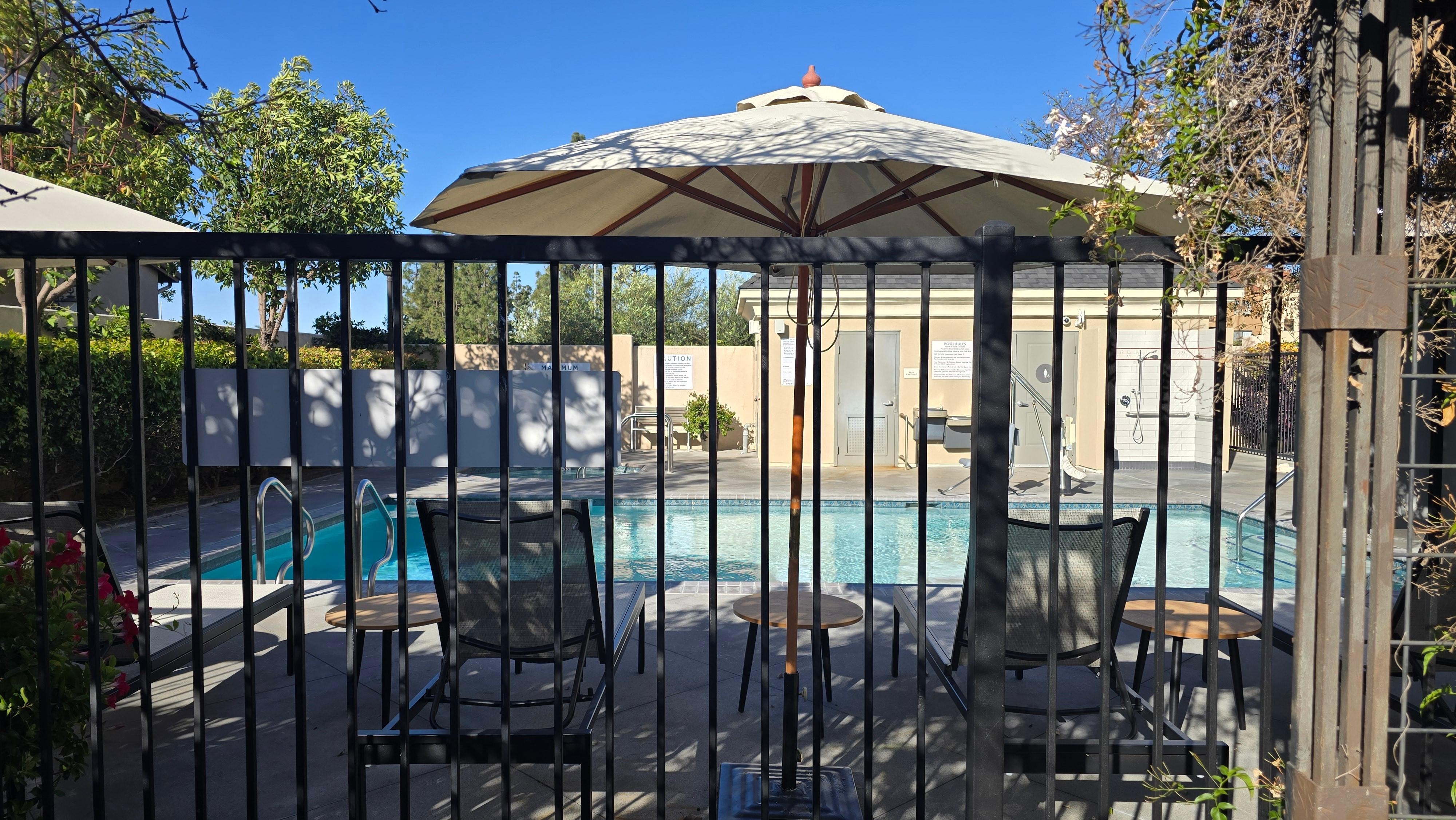 Outdoor swimming pool next to breakfast area.