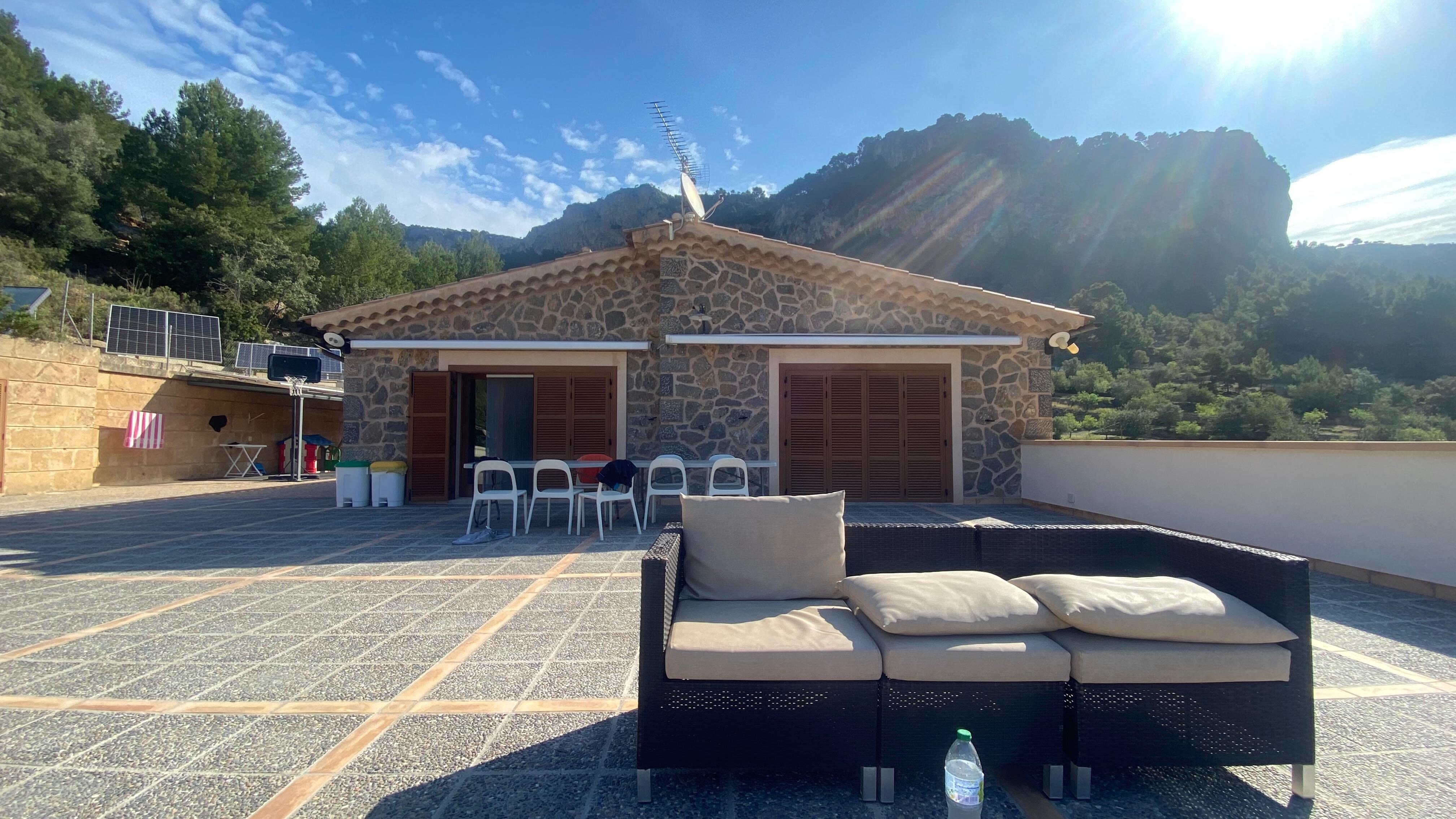 Poolside seating, looking back towards house & kids' play area.