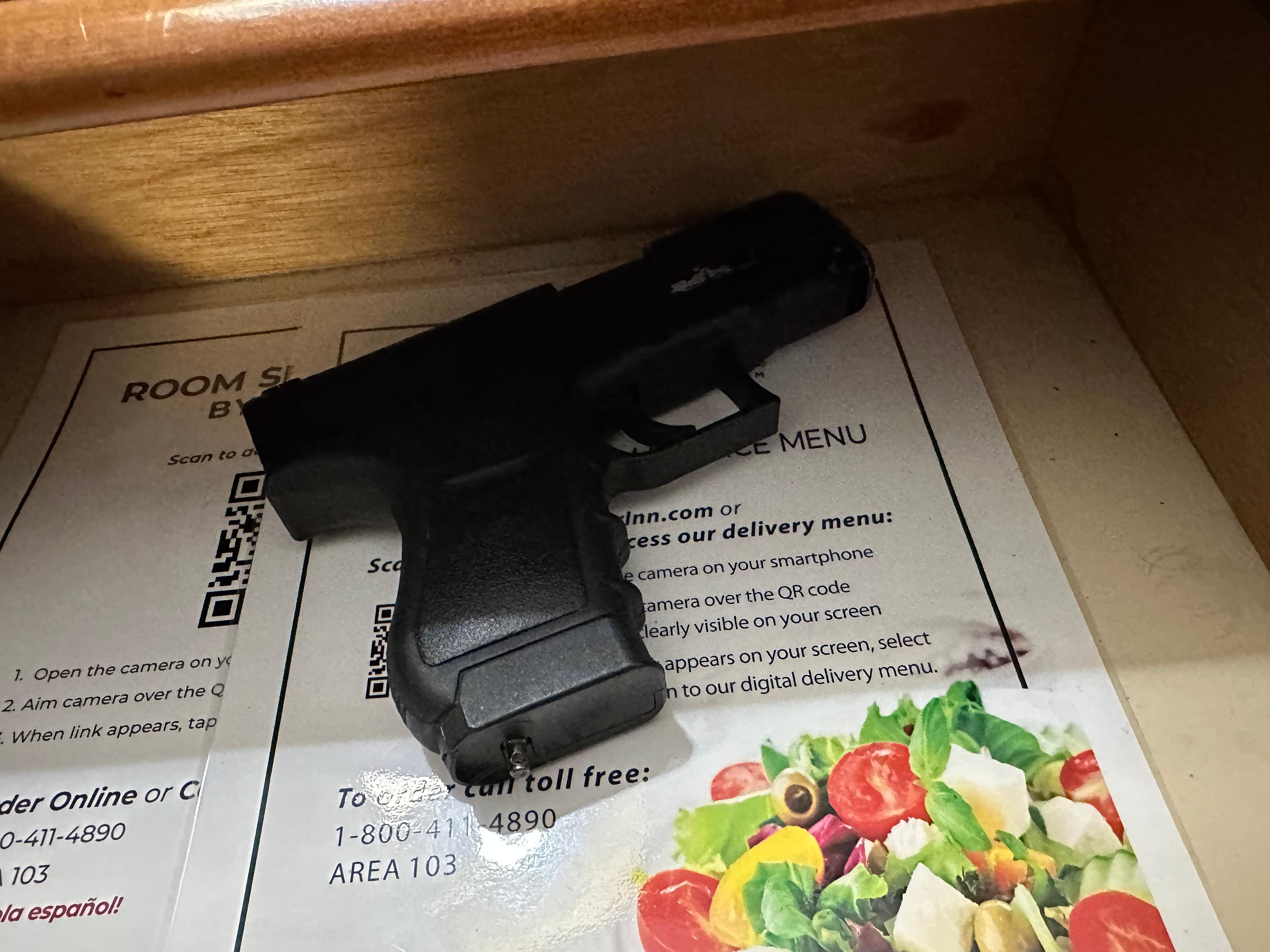 actual firearm in the drawer of the bedside table