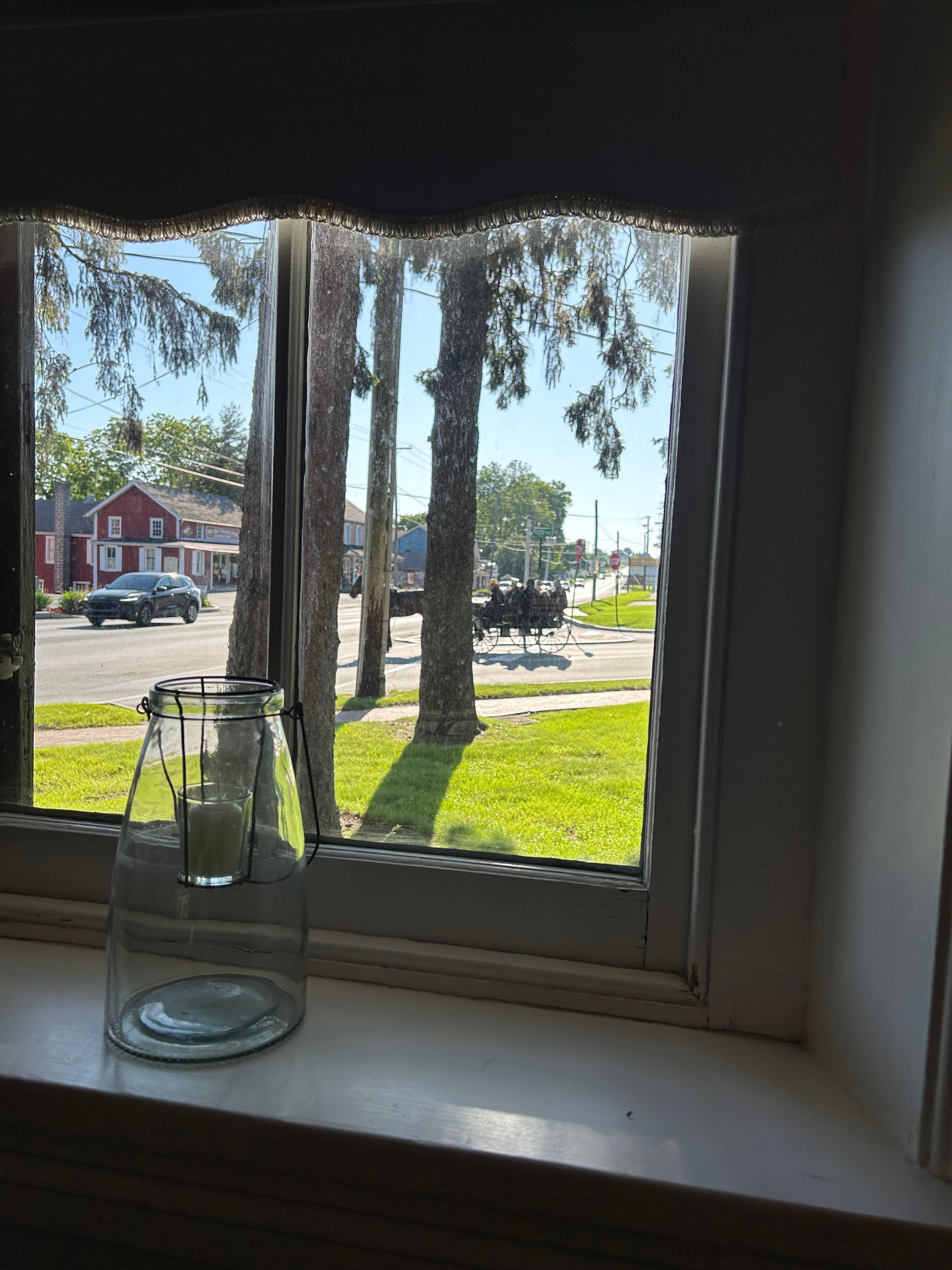 Having breakfast watching the horse and buggy’s go by