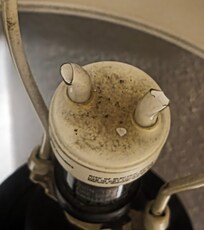 Broken and very dirty lightbulb left in lamp
